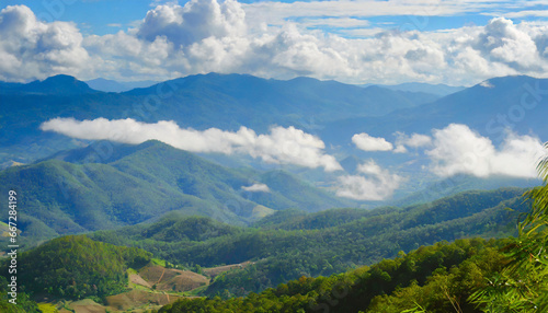 amazing wild nature view of layer of mountain forest landscape with cloudy sky natural green scenery of cloud and mountain slopes background maehongson thailand panorama view © Richard