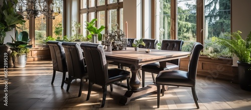 Elegant dining room with a handcrafted table © Vusal