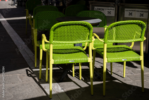 Green chairs and table in restaurant on the street © Ordasi  Tatyjana