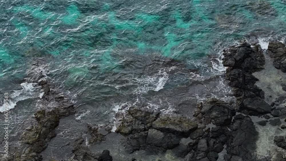 Aerial ocean Two Step rocky beach Kona Hawaii overhead. Beautiful destination for swimming, snorkel and scuba dive to enjoy underwater coral and fish. Economy is tourism based. Water . Aerial ocean Two Step rocky beach Kona Hawaii overhead. Beautiful destination for swimming, snorkel and scuba dive to enjoy underwater coral and fish. Economy is tourism based. Water .