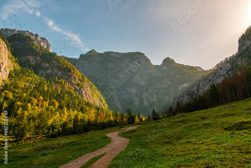 sunny landscape in the morning with a path to the mountains in southern Germany