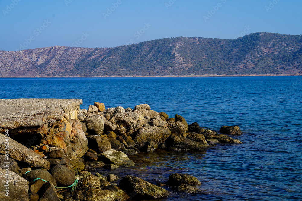 Old handmade stone pier mediterranean sea