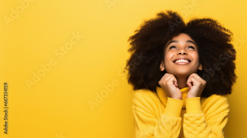 portrait of a happy young woman on a yellow background 
