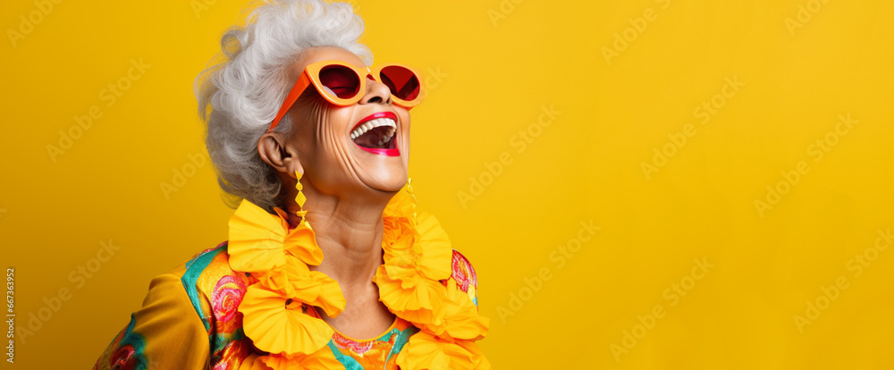Elderly woman, with gray hair, mexican latina dressed in yellow colors, smiles at life - obrazy, fototapety, plakaty 