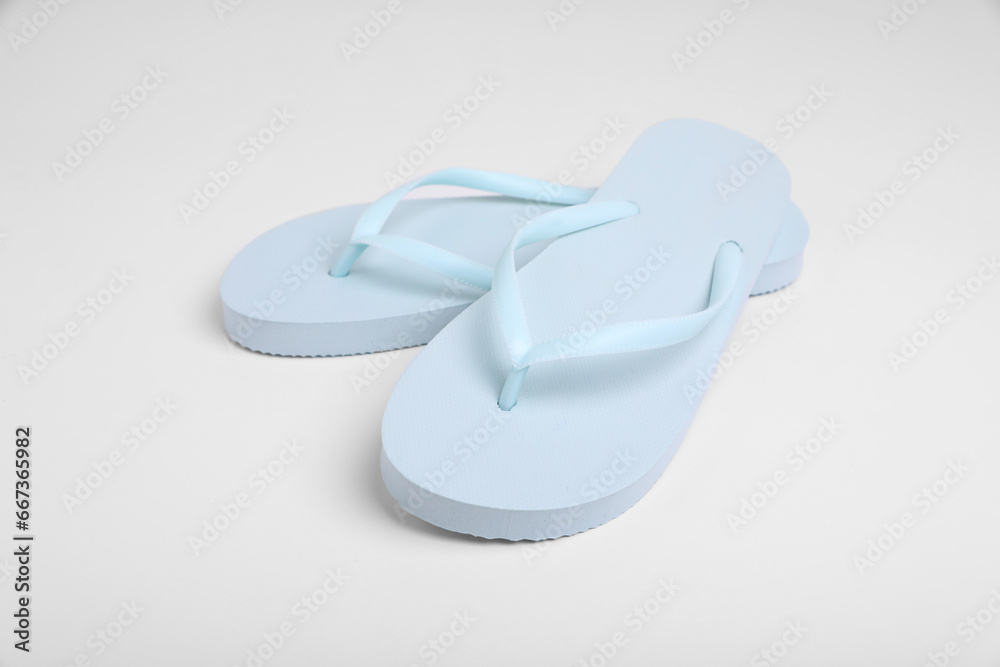 Pair of stylish flip flops on white background Pair of stylish flip flops on white background