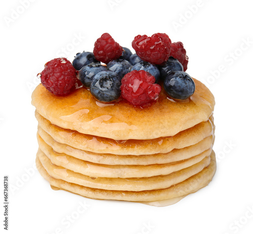 Stack of tasty pancakes with berries and honey isolated on white