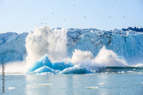 Canvas Print Closeup view of Monacobreen Glacier calving into the ocean in Liefde Fjord, Sval