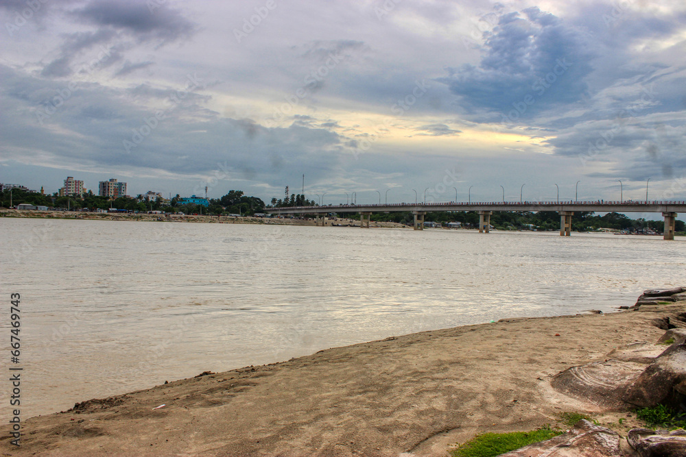 Fototapeta premium sunset over the sea, Padma river, Kushtia, Cloudy Sky, Beautiful Sky, Dusk, Ganga river, Goria River, Kushtia