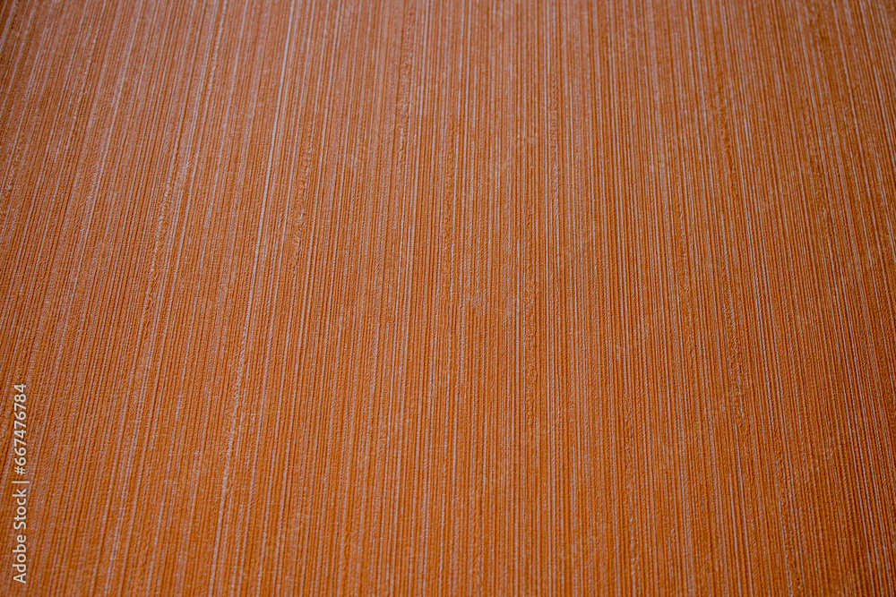 Fototapeta premium Orange background. The texture is decorative with a strip. Striped terracotta background