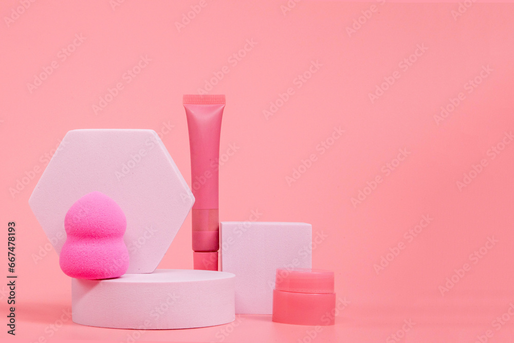 Beauty background with facial cosmetic products with empty copy space. Makeup, skin care concept with pastel colored background Beauty background with facial cosmetic products with empty copy space. Makeup, skin care concept with pastel colored background