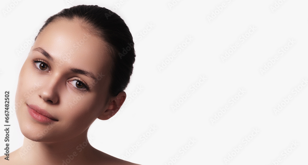 Beautiful natural girl smiling, looking happy. Portrait of a young woman with natural makeup . Care cosmetics, face and body skin care. Beautiful natural girl smiling, looking happy. Portrait of a young woman with natural makeup . Care cosmetics, face and body skin care.