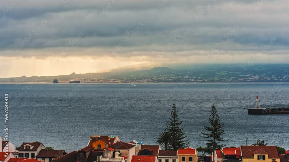 Early morning time lapse of Pico Island from Horta, Faial Island, Azores - Portugal.
High travel of clouds with golden sun rays piercing through the clouds. Early morning time lapse of Pico Island from Horta, Faial Island, Azores - Portugal.
High travel of clouds with golden sun rays piercing through the clouds.