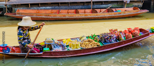 Photography market stall holders in small boats selling local fruits and vegetables, Damnoen