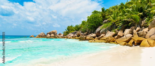 Seychelles La Digue, A white tropical beach with a turquoise colored ocean Grand Anse Beach La Digue Seychelles Islands.