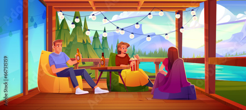 Friends or family relax on wooden terrace near lake, forest and mountains. Cartoon young adults sitting on beanbag chairs on patio, drinking beverages and eating popcorn, talking on outdoor vacation.