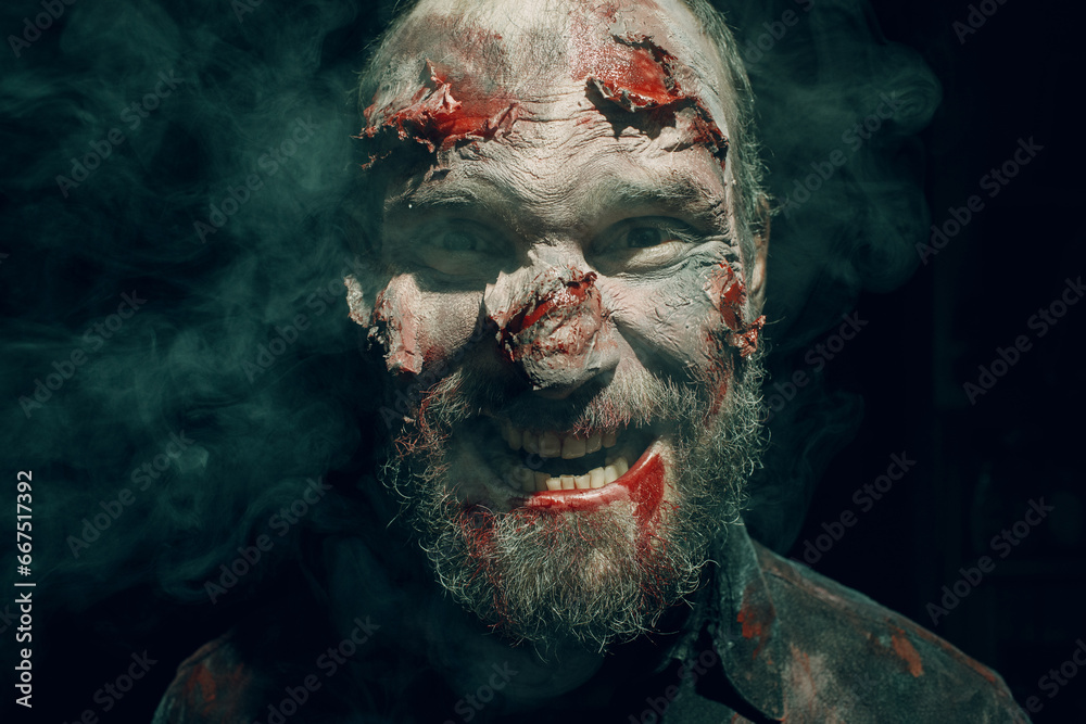 Close up portrait of horrible scary zombie dead man on halloween party Close up portrait of horrible scary zombie dead man on halloween party