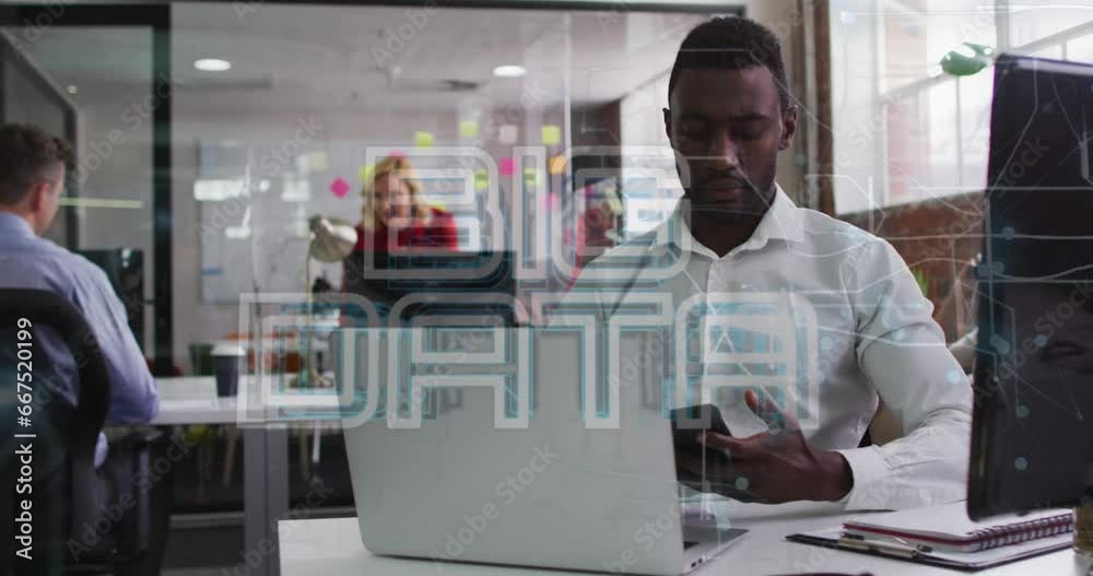 Animation of big data text over african american man talking on cellphone while working on laptop Animation of big data text over african american man talking on cellphone while working on laptop