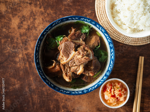 Photography top view bowl of braised pork meat with soft bone stew