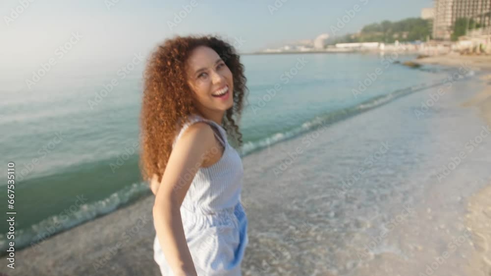Beautiful woman and her boyfriend running on sea beach at sunset. Camera moving after them Beautiful woman and her boyfriend running on sea beach at sunset. Camera moving after them