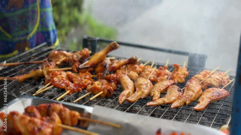 Thai Street food grilled chickens sold on the cart. Cheap delicious and popular for locals lifestyle. Thai Street food grilled chickens sold on the cart. Cheap delicious and popular for locals lifestyle.