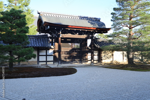  A Japanese temple : the scene of a rock garden in Japanese style and a gate in the precincts of Tenryu-ji Temple in Kyoto 日本のお寺：京都の天龍寺境内にある石庭と門の風景 photo
