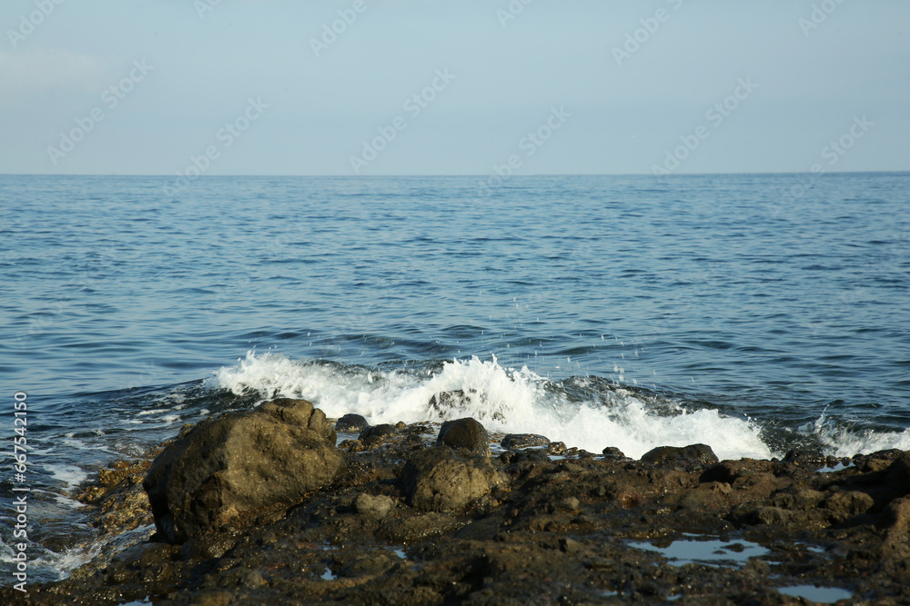 Picturesque view of sea waves splashing on stones