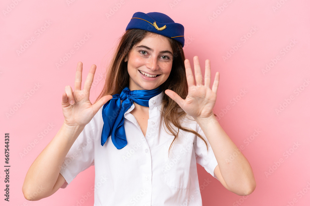 Airplane stewardess caucasian woman isolated on pink background counting eight with fingers Airplane stewardess caucasian woman isolated on pink background counting eight with fingers
