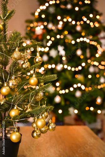 A New Year tree adorned with twinkling lights creates a captivating and festive ambiance during the holiday season.