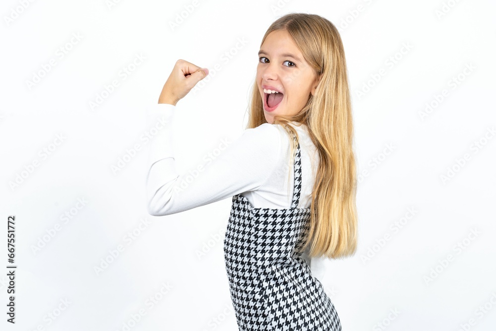 Profile side view portrait Beautifu blonde kid girl celebrates victory Profile side view portrait Beautifu blonde kid girl celebrates victory