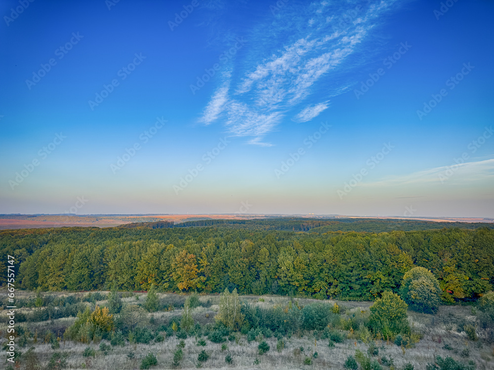 Fototapeta premium Perfect landscape view before the sunset. Warm sunny light and perfect clouds made a beautiful mood