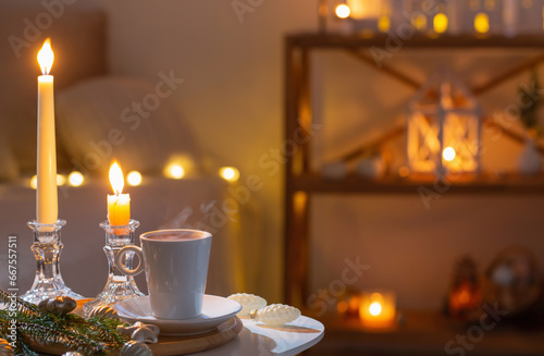 cup of tea on table with white decorations in white interior