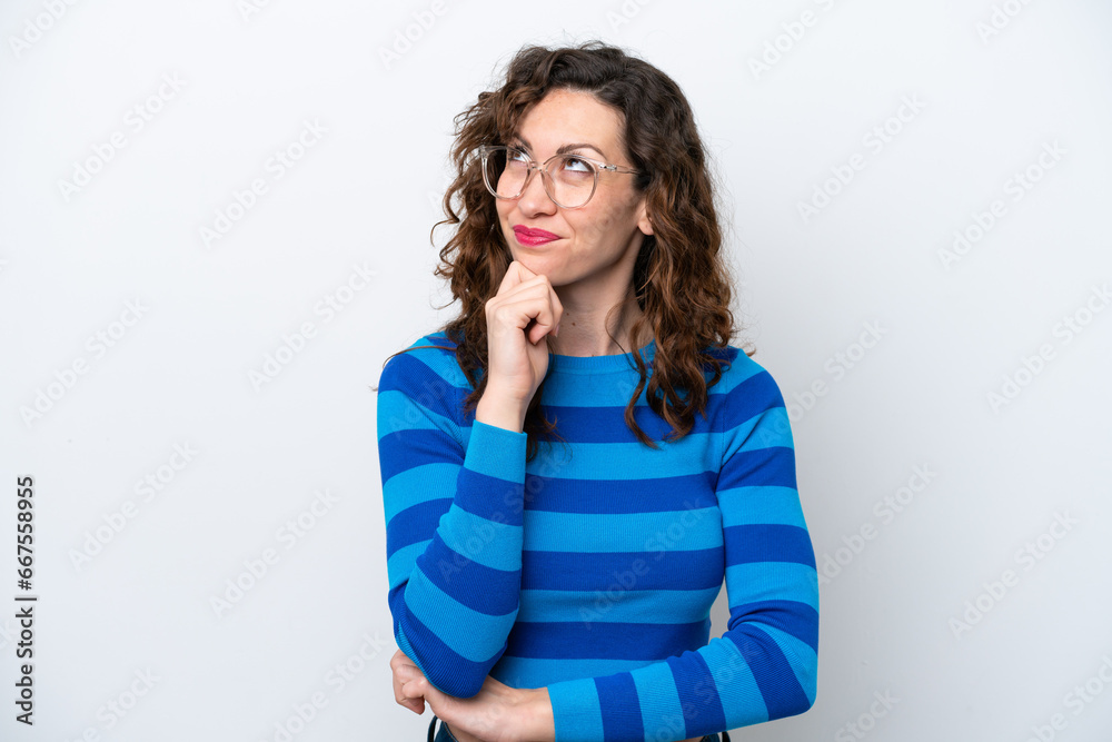 Young caucasian woman isolated on white background and looking up Young caucasian woman isolated on white background and looking up