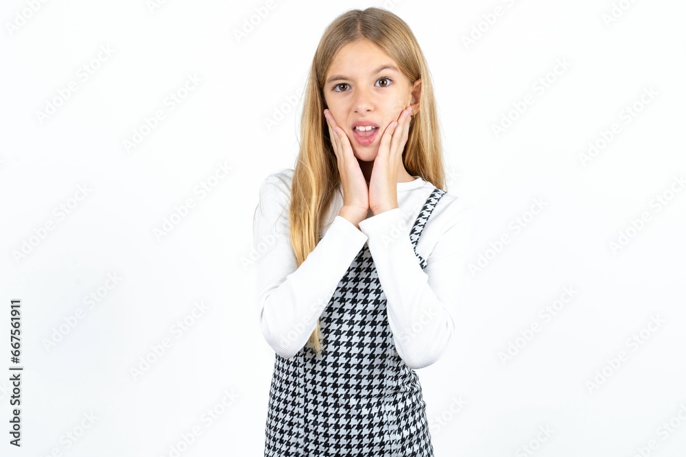 Upset Beautiful caucasian teen girl touching face with two hands Upset Beautiful caucasian teen girl touching face with two hands