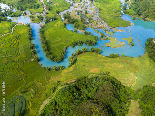 Aerial landscape in Quay Son river, Trung Khanh, Cao Bang, Vietnam with nature, green rice fields and rustic indigenous houses