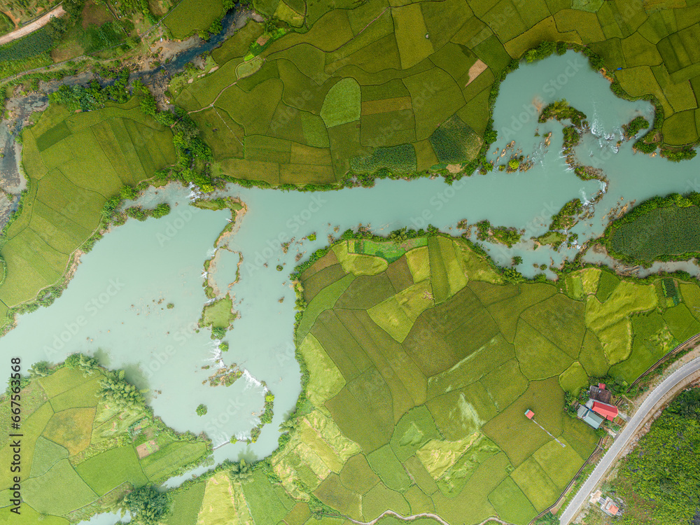 Fototapeta premium Aerial view of dawn on mountain at Ngoc Con ward, Trung Khanh town, Cao Bang province, Vietnam with river, nature, green rice fields. Near Ban Gioc waterfall.