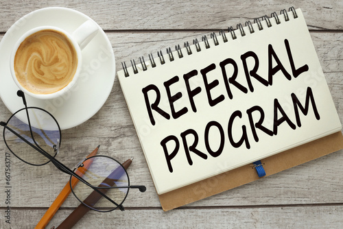 Referral program cup of coffee with notepad with text Tax Planning