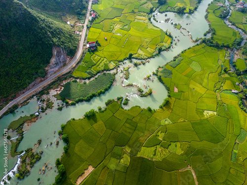 Aerial view of dawn on mountain at Ngoc Con ward, Trung Khanh town, Cao Bang province, Vietnam with river, nature, green rice fields. Near Ban Gioc waterfall. photo