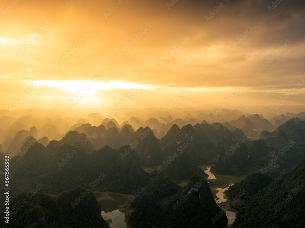 Aerial view of Thung mountain in Tra Linh, Cao Bang province, Vietnam with lake, cloudy, nature.