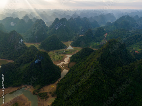 Aerial view of Thung mountain in Tra Linh, Cao Bang province, Vietnam with lake, cloudy, nature. photo