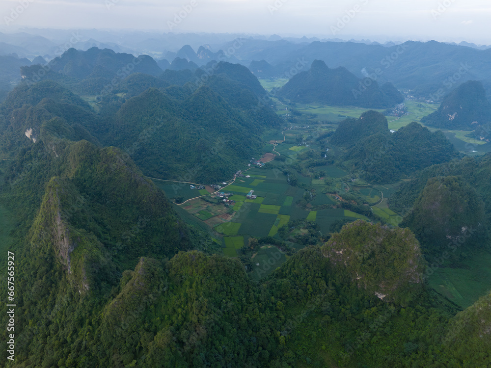 Aerial view of Thung mountain in Tra Linh, Cao Bang province, Vietnam with lake, cloudy, nature.