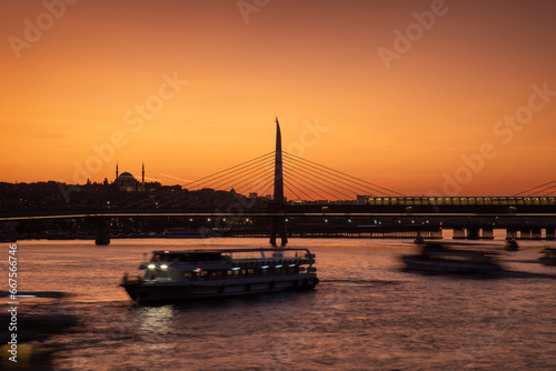 Ferries and boats in Golden Horn Bay at sunset, Istanbul, Turkey