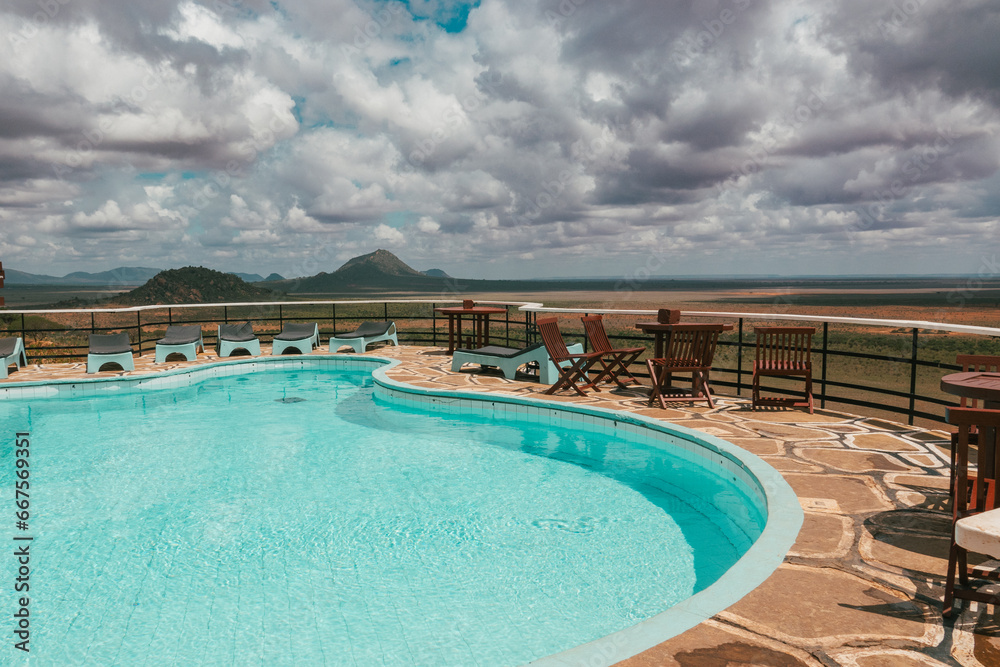 Fototapeta premium View of a swimming pool against a scenic view point at Tsavo East National Park, Kenya