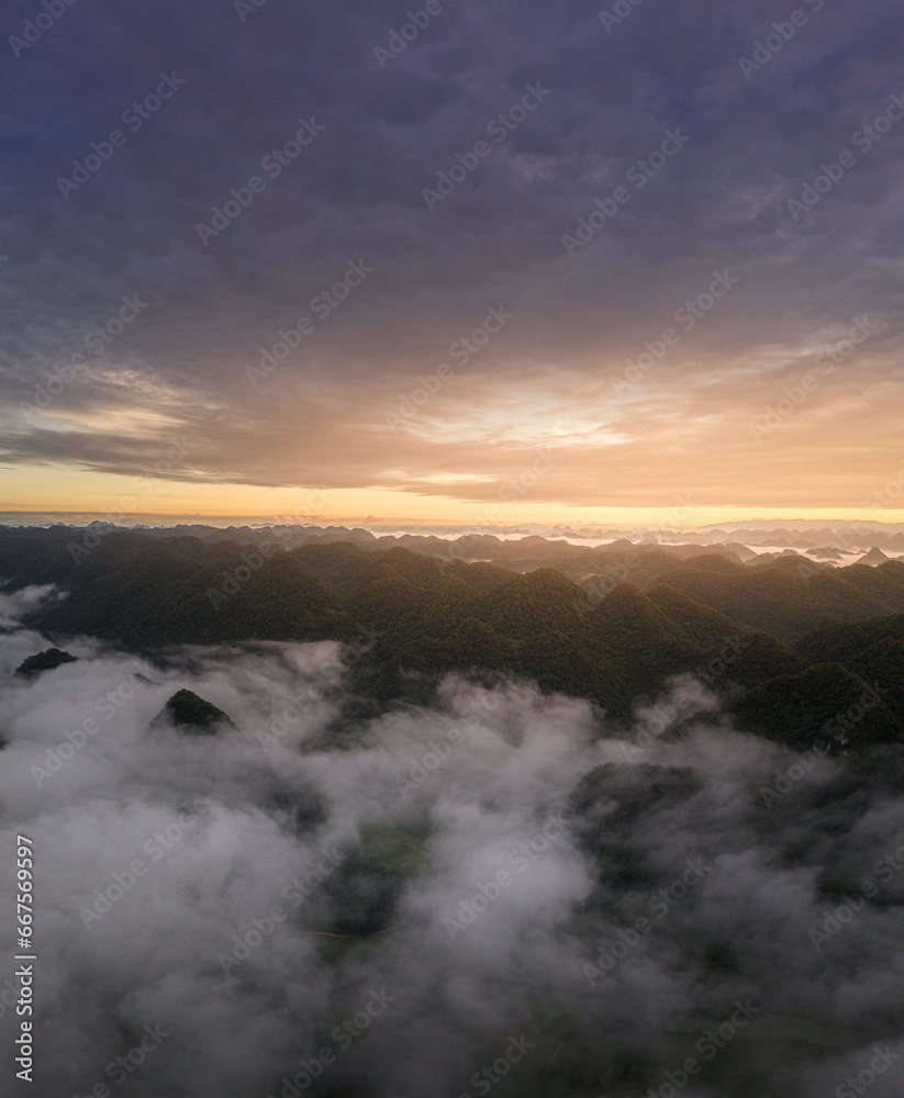 Fototapeta premium Aerial landscape in Phong Nam valley, an extreme scenery landscape at Cao bang province, Vietnam with river, nature, green rice fields