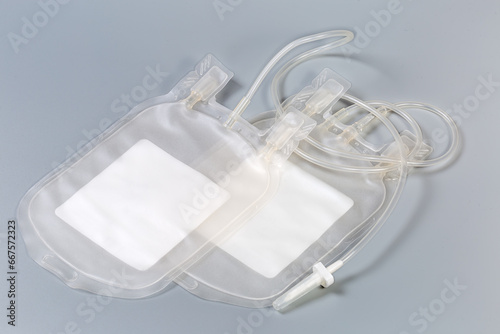 Blood transfusion system with double blood bags on gray background photo