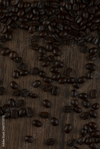 Roasted coffee bean on wooden table.