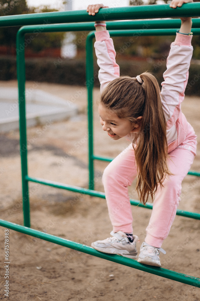 Fototapeta premium little child playing on playground