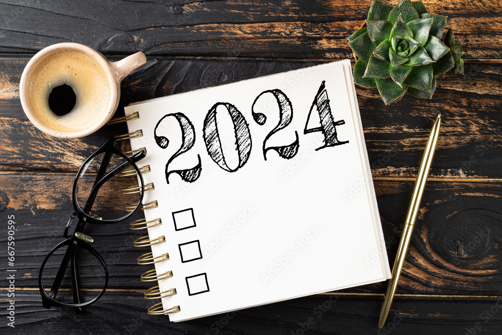New year resolutions 2024 on desk 2024 resolutions list with notebook New year resolutions 2024 on desk 2024 resolutions list with notebook