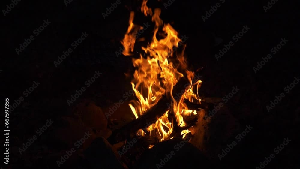 Super Slow Motion. A bright fire burns in complete darkness Super Slow Motion. A bright fire burns in complete darkness