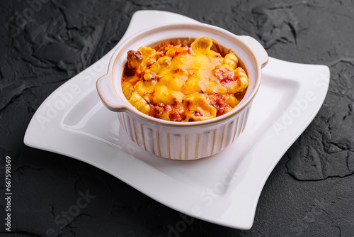 Macaroni and cheese baked on plate photo