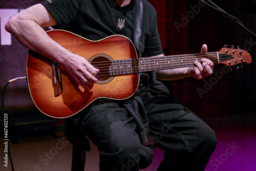 Ukrainian male bard playing guitar.